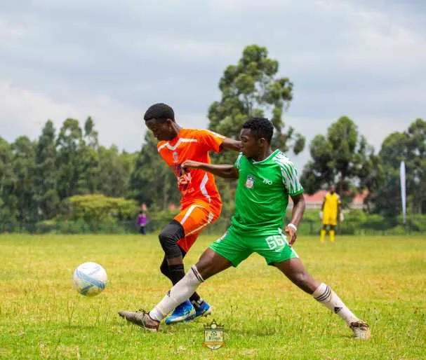 Jerome shielding ball vs Kings Academy during Moi Cup